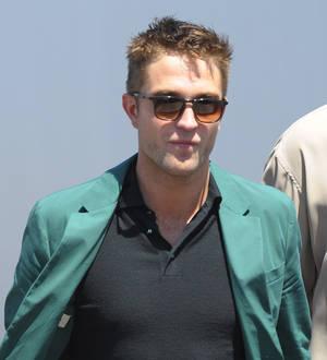 Robert Pattinson's Cannes premiere gatecrashed by topless woman