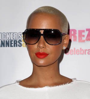 Amber Rose spotted cozying up to Gene Simmons' son