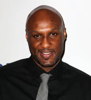 Lamar Odom 'breathing on his own'