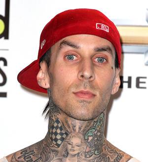 Travis Barker considers hypnotherapy so he can fly again after plane crash