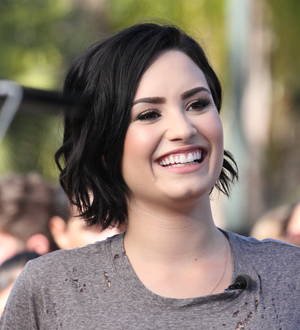 Wilmer Valderrama surprises Demi Lovato at charity concert