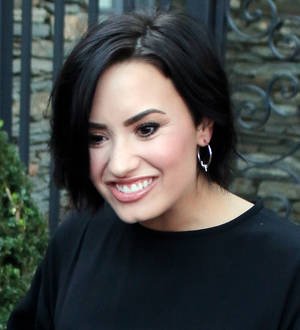 Demi Lovato takes a dive at pool party to launch summer single