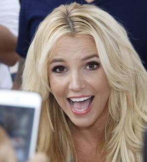 Britney Spears takes a tumble on stage