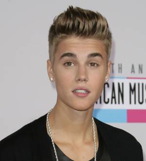 Justin Bieber releases free track for fans after crashing chat site
