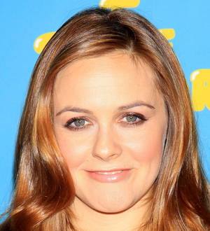 Alicia Silverstone fronts feather expose for PETA