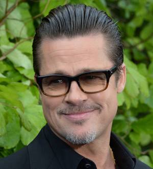 Brad Pitt performs with Bruno Mars