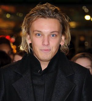 Jamie Campbell Bower celebrating campaign win