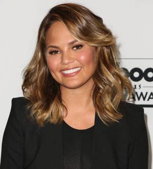 Chrissy Teigen strips for stunning Dujour spread