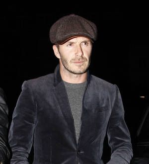David Beckham braves blizzard chaos for wife's fashion show