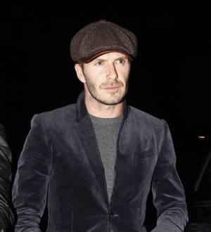 David Beckham braves blizzard chaos for wife's fashion show
