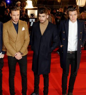 One Direction surprise young fans during documentary screening