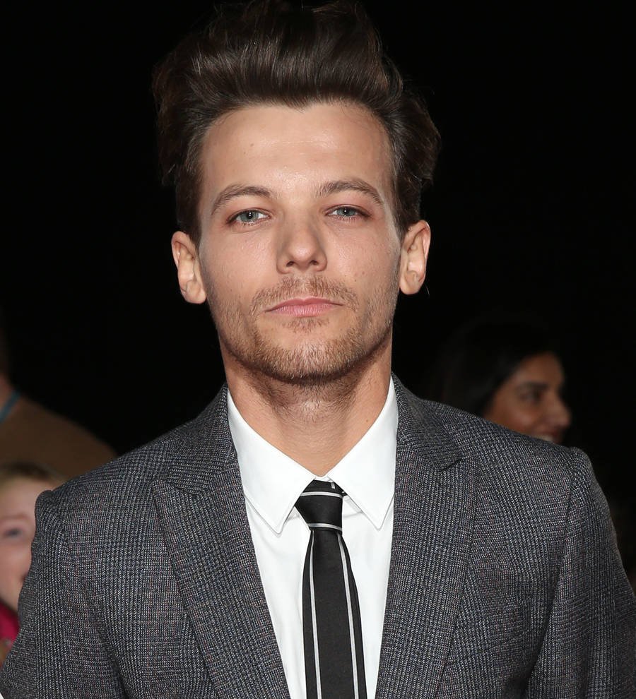 Louis Tomlinson signs new solo deal with mentor Simon Cowell