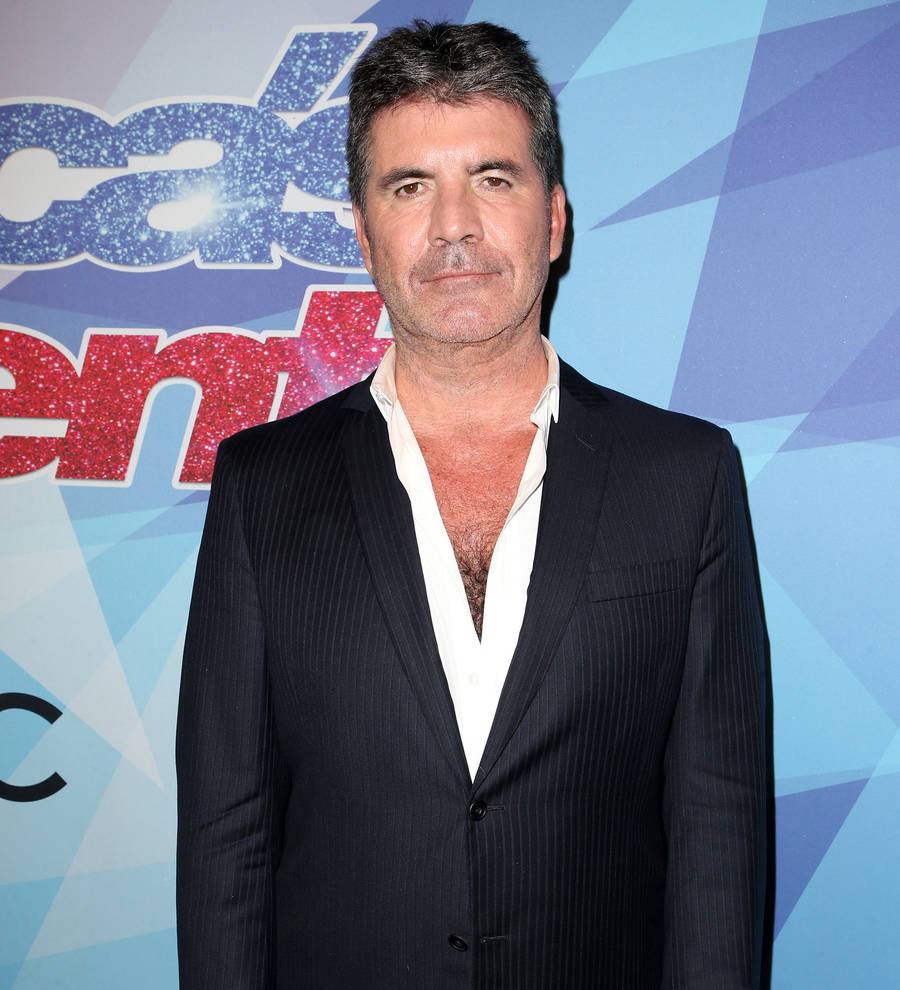 Simon Cowell makes up with Mel B after she stabs him with rubber knife