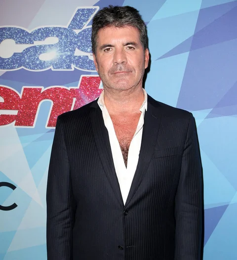 Simon Cowell makes up with Mel B after she stabs him with rubber knife