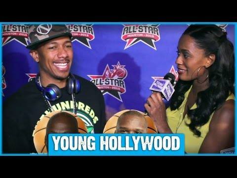 J-Hope of BTS poses smiling on the red carpet at the NBA All-Star Game