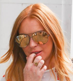 Lindsay Lohan and her brother want former associate jailed