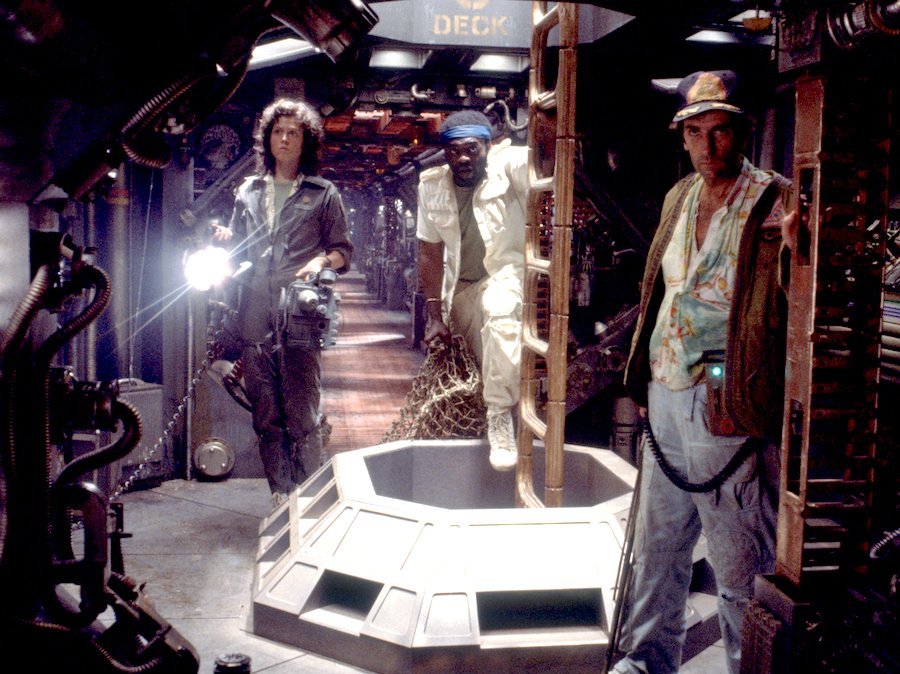 Sigourney Weaver as Ellen Ripley in a still from the movie Alien, green-lit face close-up