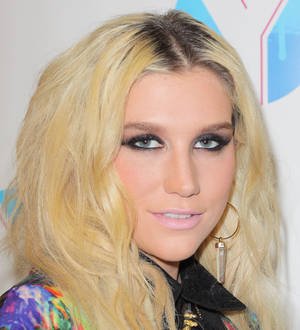 Ke$ha hires glitter guy to make sure she's always sparkling