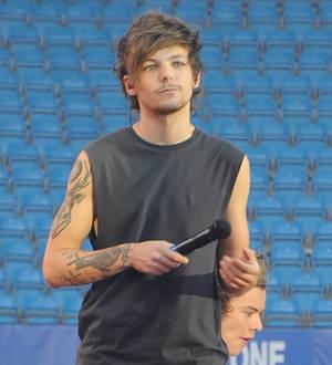 One Direction attend Louis Tomlinson's family wedding
