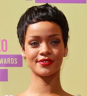 Rihanna is topless and Unapologetic on new album cover