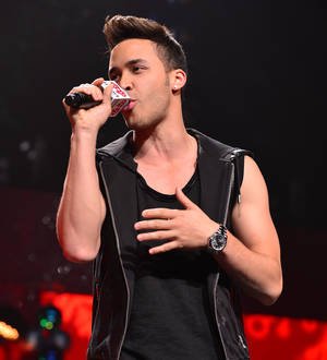 Prince Royce falls off stage during gig