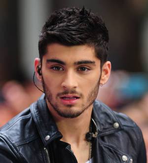 Zayn Malik donates guitar to children's charity
