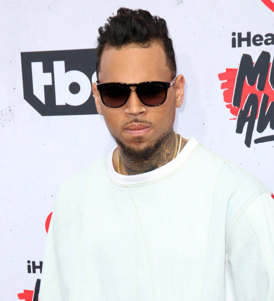 Chris Brown blasts gun threat allegations as cops surround home