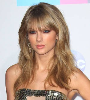 Taylor Swift strikes gold with quadruple win at American Music Awards