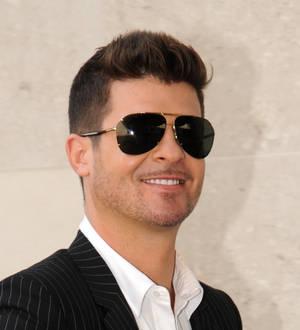 Robin Thicke teams up with dad and young son for new song