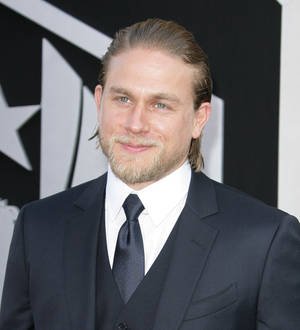 Charlie Hunnam arms himself against burglars