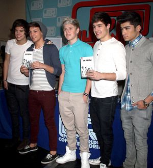 One Direction serve as flight attendants for charity
