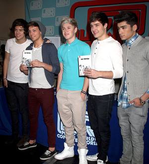One Direction serve as flight attendants for charity