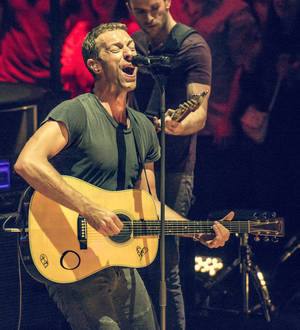 Chris Martin's first acoustic guitar up for auction