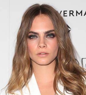 Cara Delevingne laughs off love split by taking girlfriend to premiere