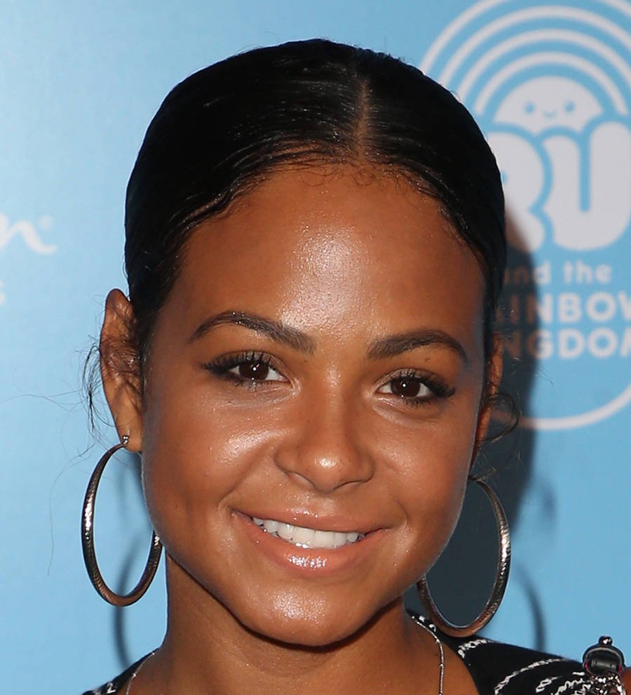 Christina Milian and Matt Pokora pose together in swimwear on a yacht