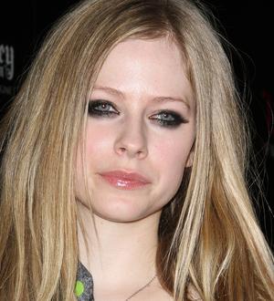Avril Lavigne turns check-out assistant for charity