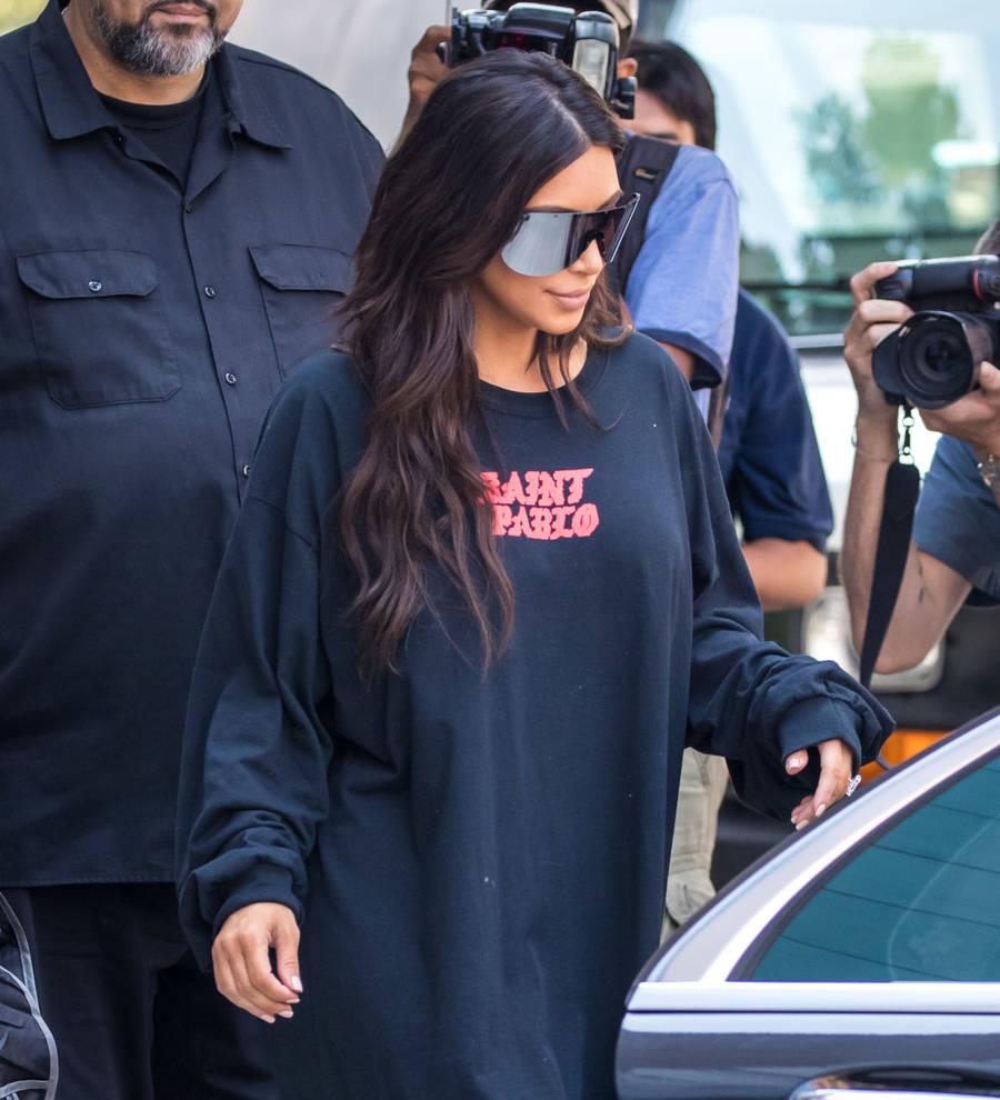 Kim Kardashian 'badly shaken' after being held at gunpoint in hotel room