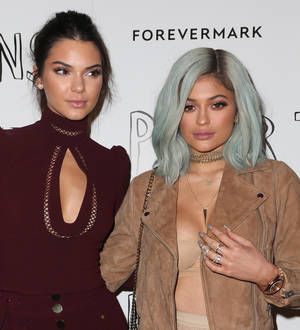 Kendall and Kylie Jenner celebrate graduation with surprise party