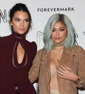 Kendall and Kylie Jenner celebrate graduation with surprise party