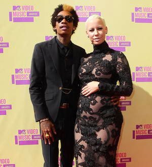 Pregnant Amber Rose calls Wiz Khalifa her husband