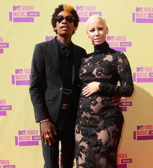 Pregnant Amber Rose calls Wiz Khalifa her husband