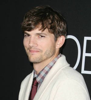Ashton Kutcher pokes fun at Charlie Sheen on Two and a Half Men