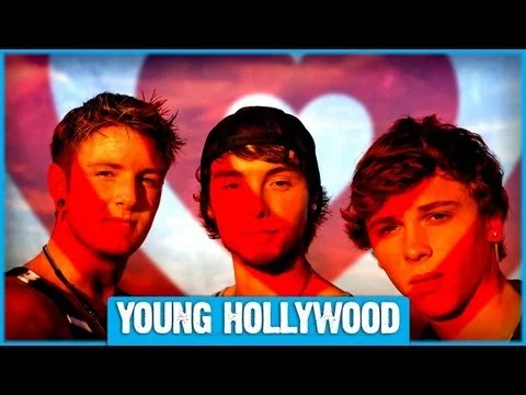 Emblem3 band members with Young Hollywood pose on a red carpet at an event