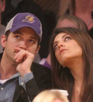 Ashton Kutcher and Mila Kunis man the phone bank for Red Nose Day