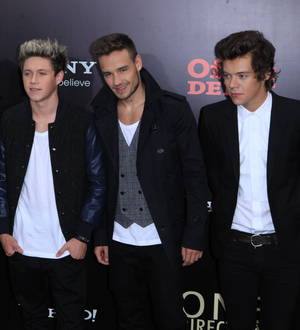 One Direction sign big money deal with Simon Cowell