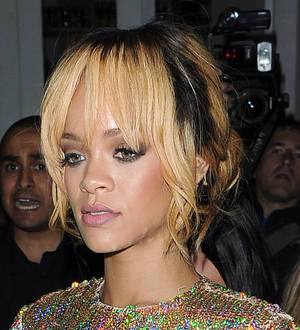 Rihanna takes a swipe at fan with microphone