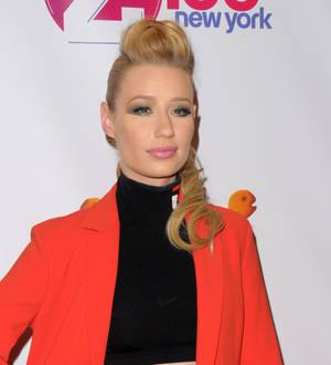 Iggy Azalea granted injunction to block distribution of early songs