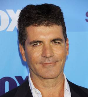 Cowell donates,000 to U.K. riot clean-up fund