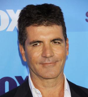 Cowell donates,000 to U.K. riot clean-up fund