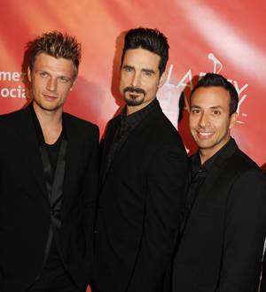 Backstreet Boys cuddle pandas in China